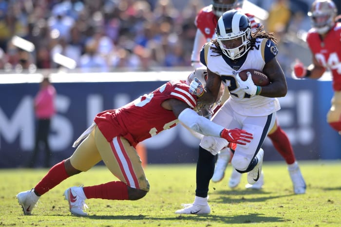 Los Angeles Rams running back Darrell Henderson (27) is tackled by San Francisco 49ers middle linebacker Kwon Alexander (56)
